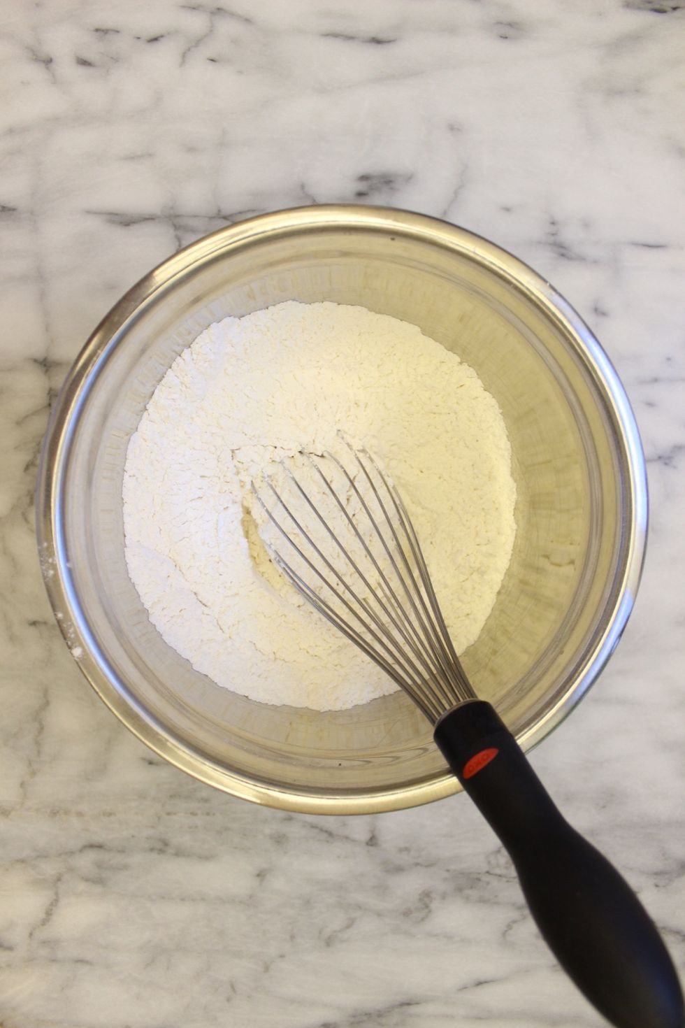 In a medium bowl, whisk together the all-purpose flour (sifted), baking soda, baking powder, and salt. Set aside.