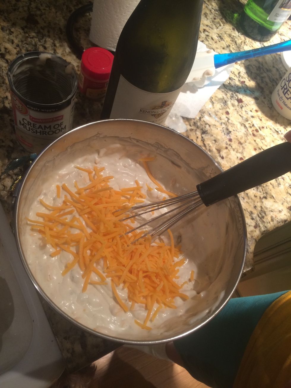 In a medium mixing bowl, combine the soup, mayonnaise, sour cream, cheddar cheese, lemon juice, curry powder, salt-and-pepper to taste, and wine. Whisk together to make sauce.