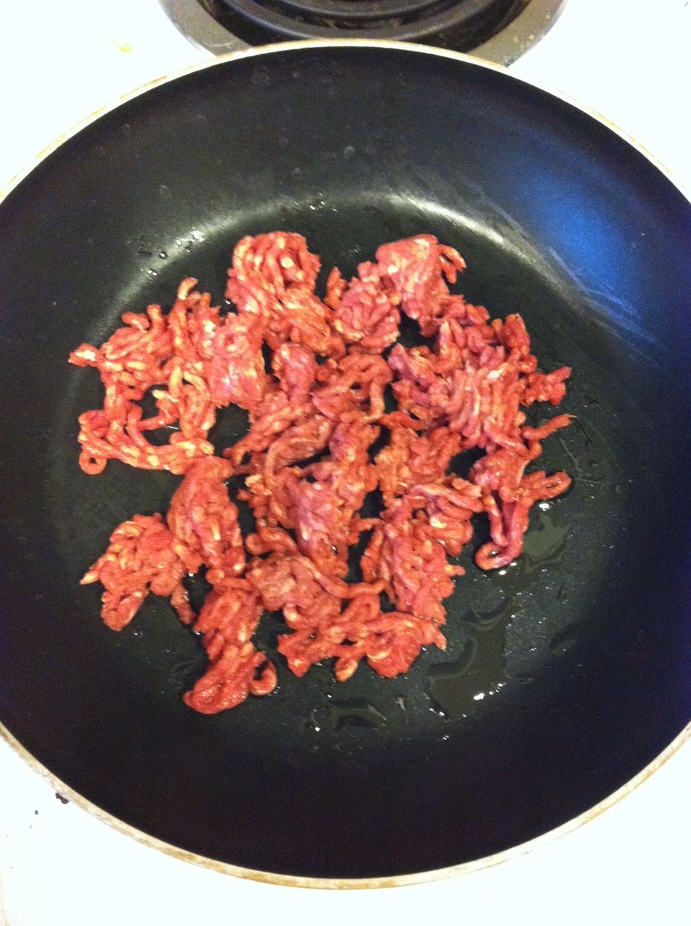 In a medium pan coated with vegetable oil or vegetable oil cooking spray saut\u00e9 your ground beef for about 5 minutes on medium high.