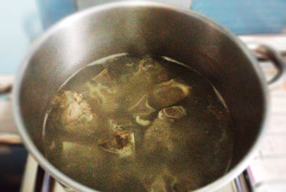 In a medium pot, Bring 2-2.5 liter of water to a boil and cook the rib bones until the meat is quite soft. My Mom usually do this 2 or 3 times. This process will make an awesome broth for this soup :)