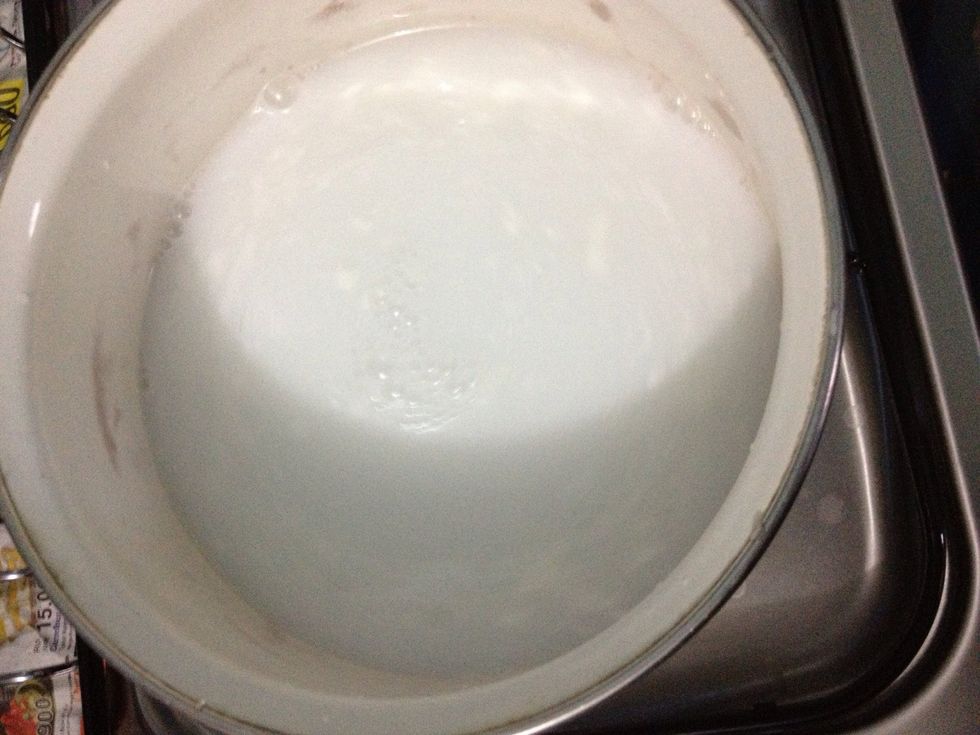 In a medium pot, combine 200ml of coconut milk and 500ml of water, stir occasionaly to a boil