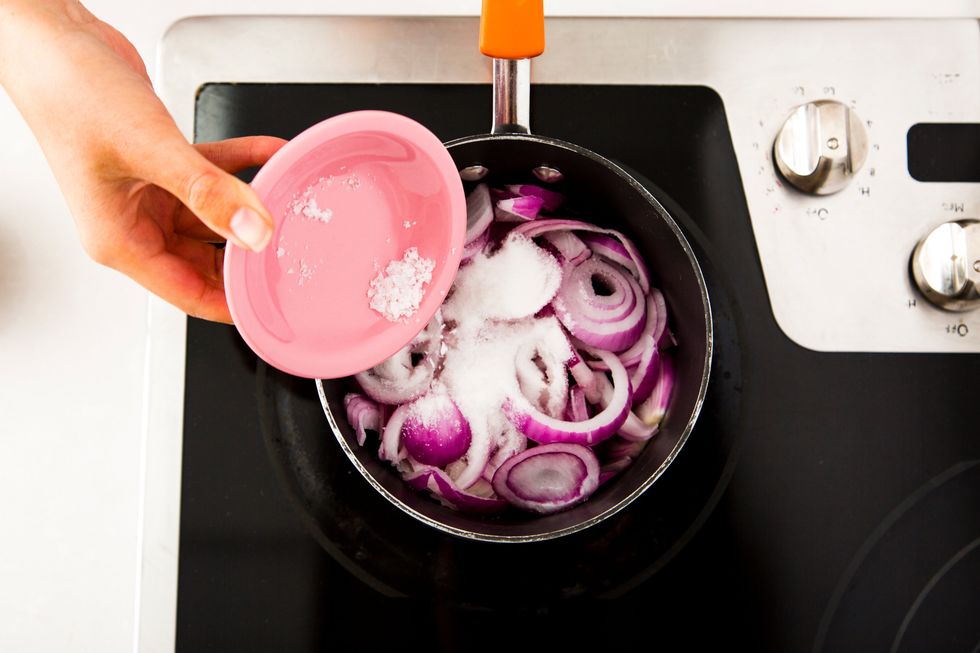 In a medium saucepan, combine the onions, one cup cider vinegar, \u00bc cup sugar and one teaspoon salt.