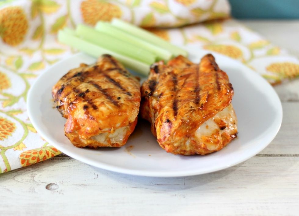In a microwave safe bowl (I used a pyrex measuring cup) melt the butter for 8 seconds. Stir in hot sauce and celery salt.