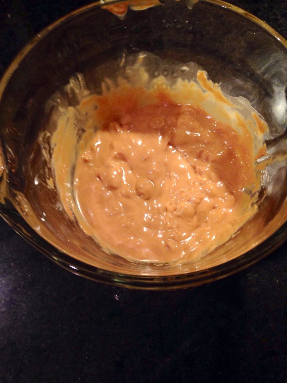 In a microwave-safe bowl, microwave the peanut butter chips and the rest of the oil.
