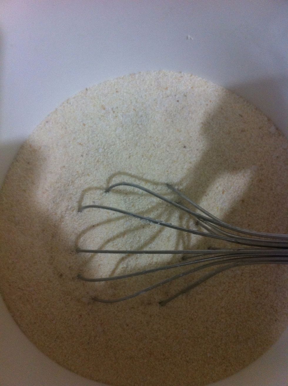 In a mixing bowl, add the semolina and sugar