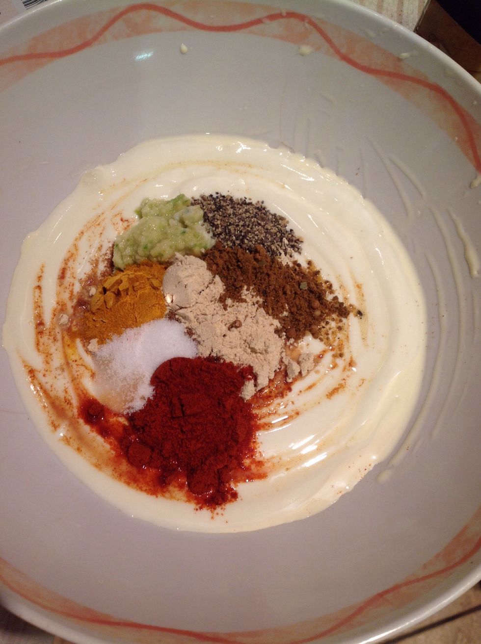 In a mixing bowl add the yogurt (1 tbs per portion of chicken), 1 tbs of ginger/garlic paste, 1 tsp of lemon juice, 1 tsp of salt and pepper and the remaining spices.