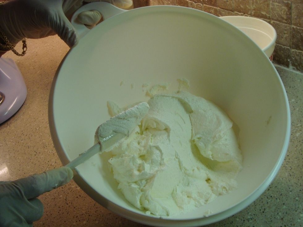 In a mixing bowl, cream the sugar and butter until fluffy and light.