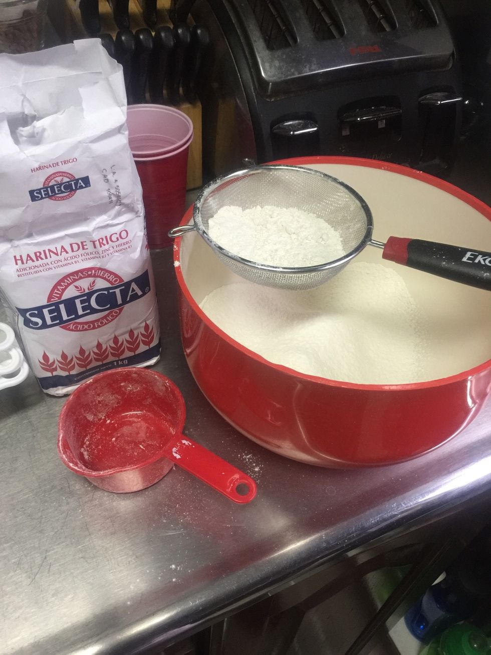 In a mixing bowl sift the flour, baking soda and baking powder. Mix well and set aside.
