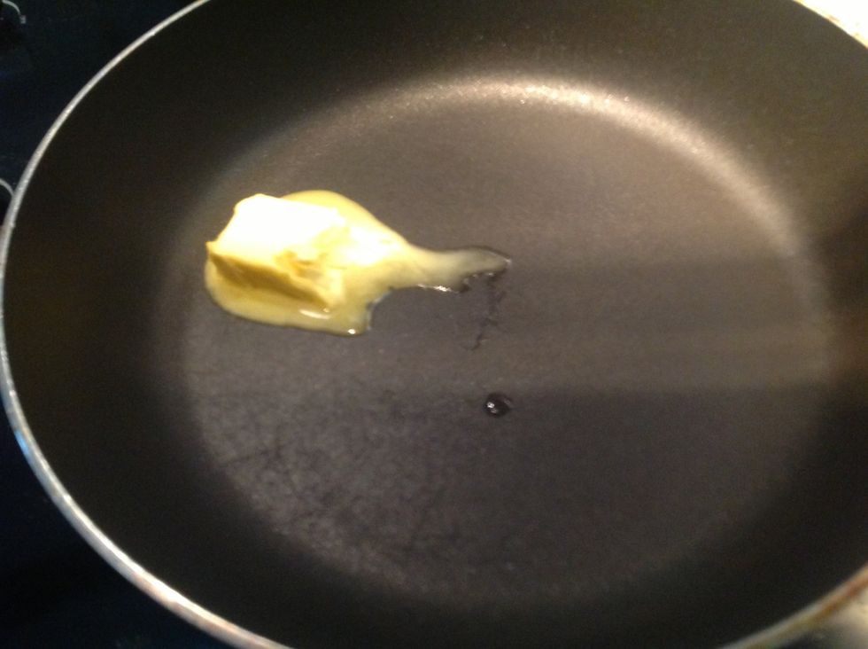 In a non stick frying pan, turn on to low heat. Put 1 tablespoon of butter, wait until melted