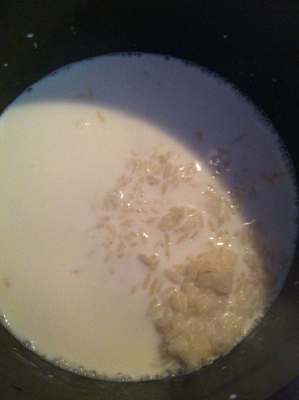 In a non stick pan add your cooked rice and your milk stir