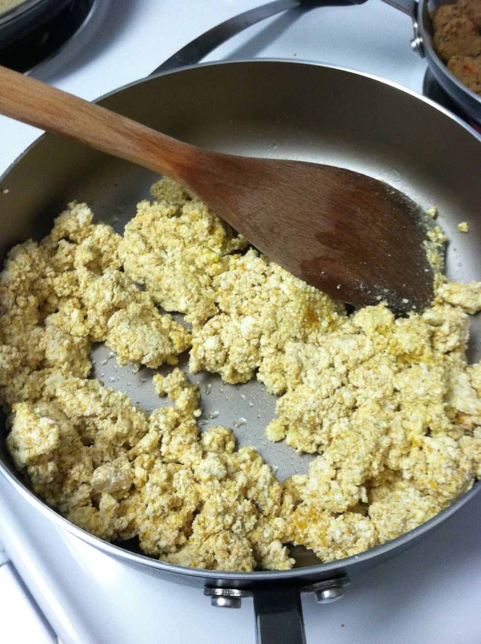 In a pan, add about a tablespoon of olive oil and cook up your tofu until golden.