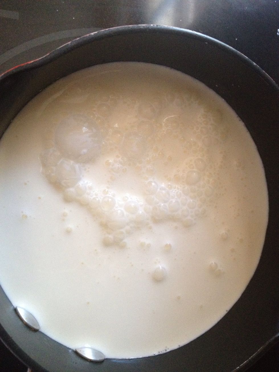 In a pan add regular milk and heavy cream milk also add sugar, cardamom and pinch of saffron add according to your taste I have not put how much cause it depends how many people your feeding