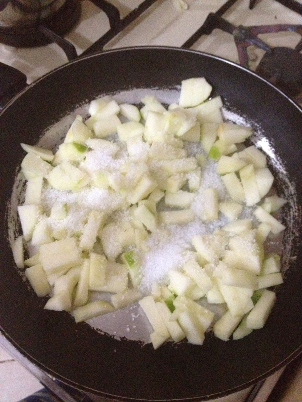 In a pan add suger