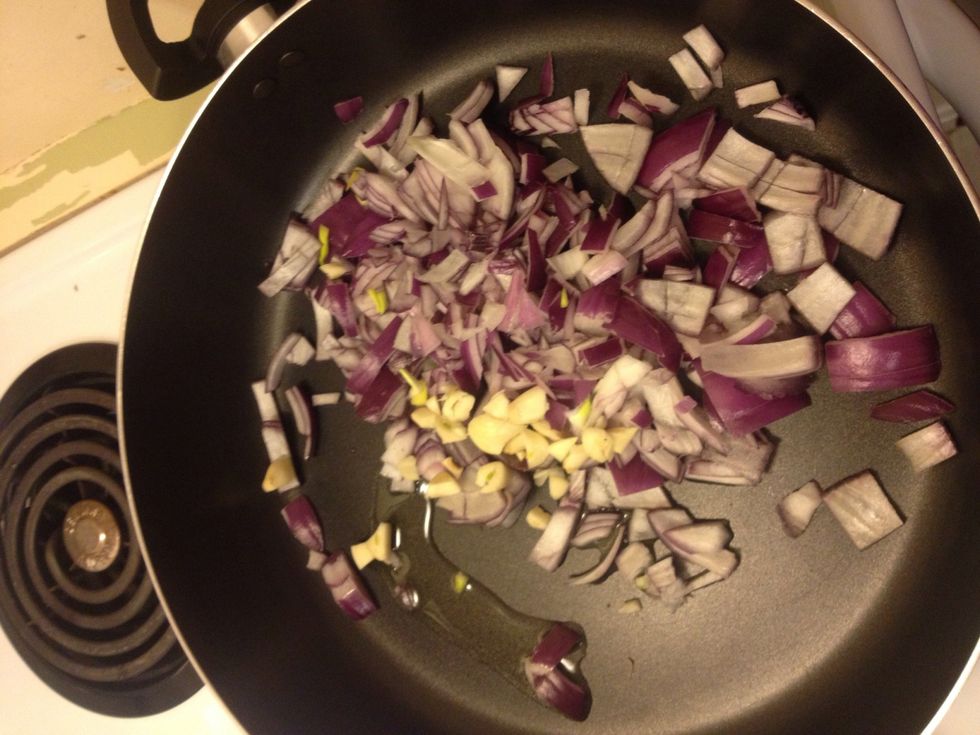 In a pan cook onion, last T of oil with 4 garlic cloves