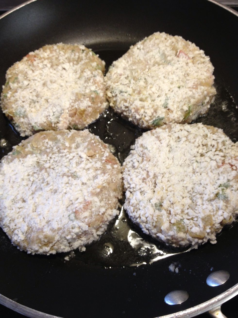 In a pan get oil make sure it's hot but not to hot, now add your burgers in , it should sizzle