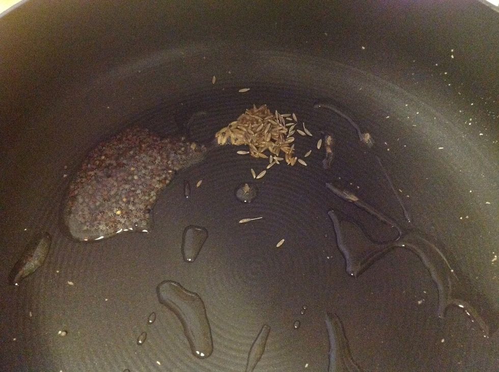 In a pan heat a little oil and add mustard seeds and cumin.