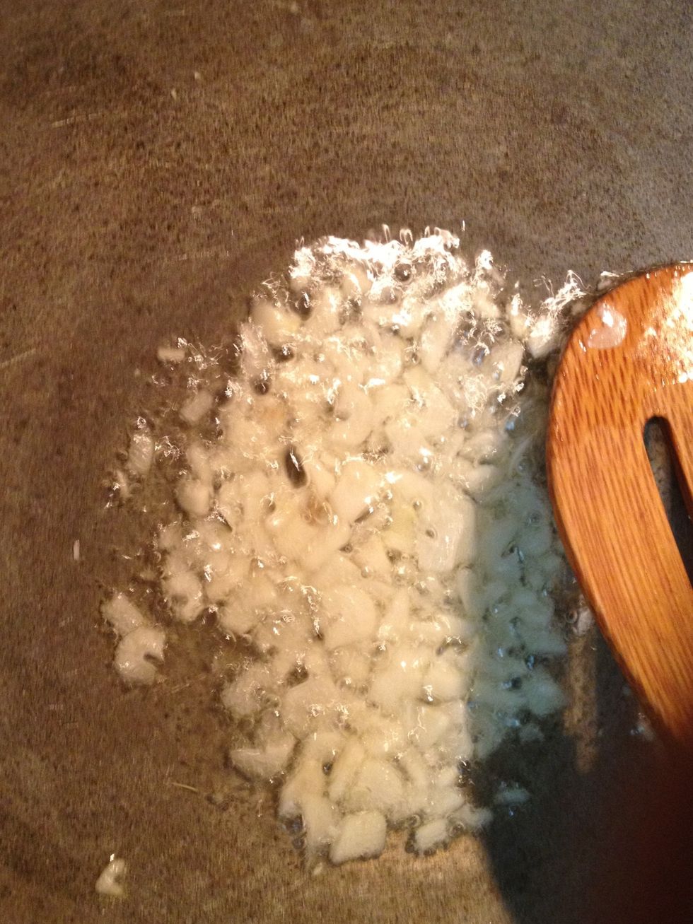 In a pan heat some oil add garlic and saut\u00e9 for a minute