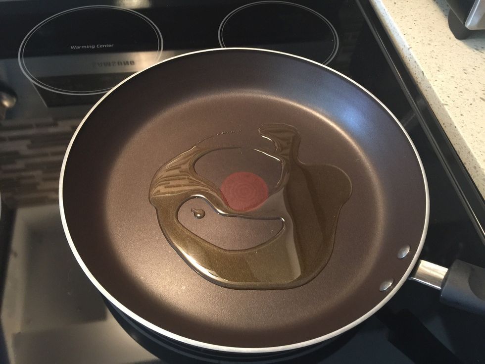 In a pan, heat the olive oil