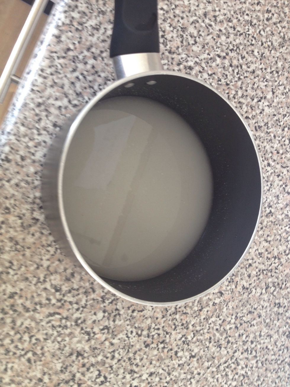 In a pan, mix the sugar with the water on high heat until it comes to a boil.