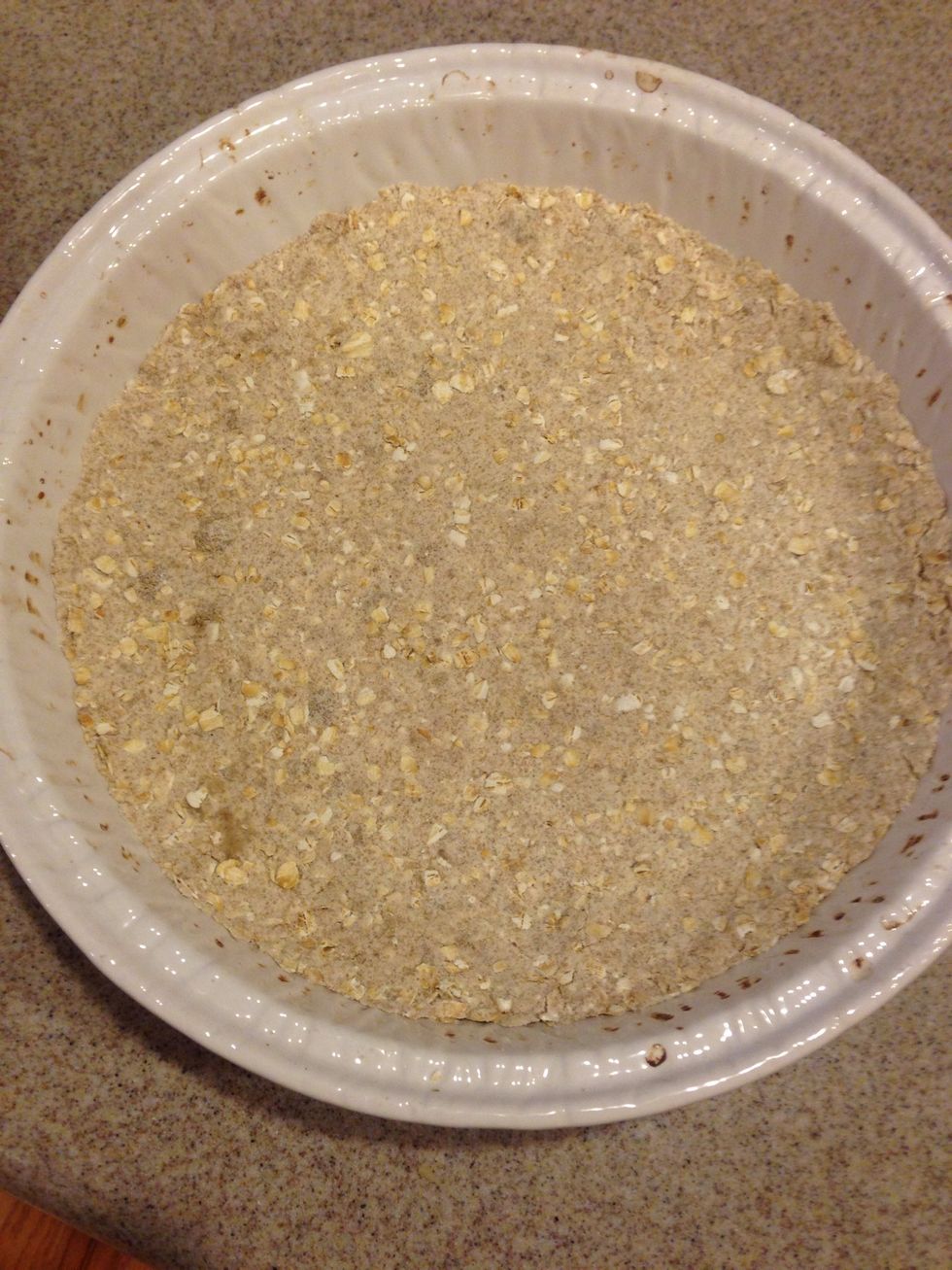 In a pan of your choice, pack in tightly, part of your crumble mix and use your fingers to push everything down.