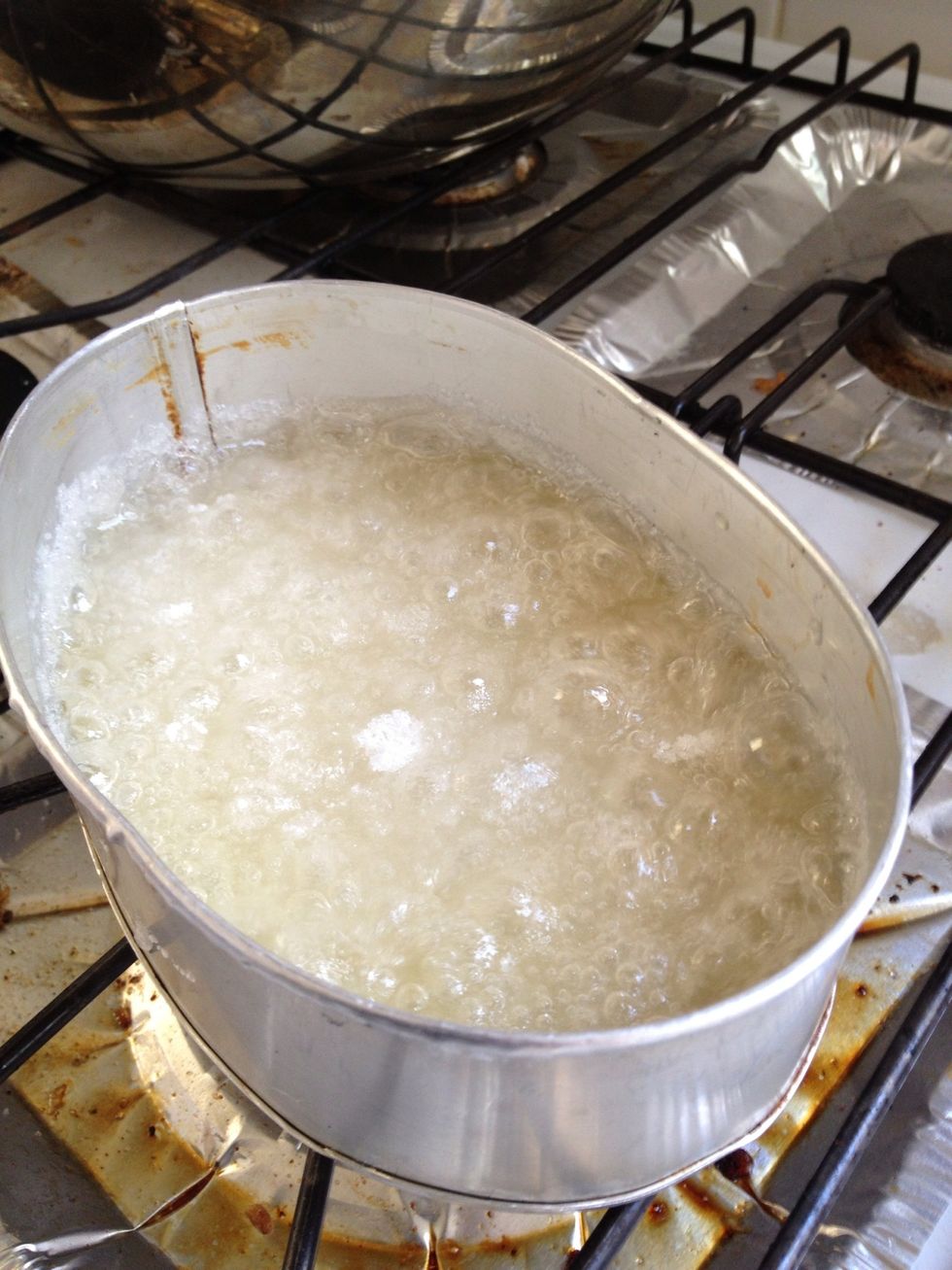 in a pan or tray, place the sugar and moisten with a liytle water heat until brown and caramelized, swirling the pan constantly once caramelized, set aside to cool