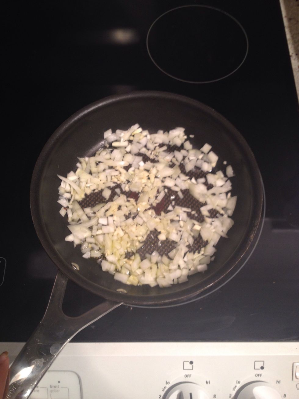 In a pan, pan fry onion and garlic