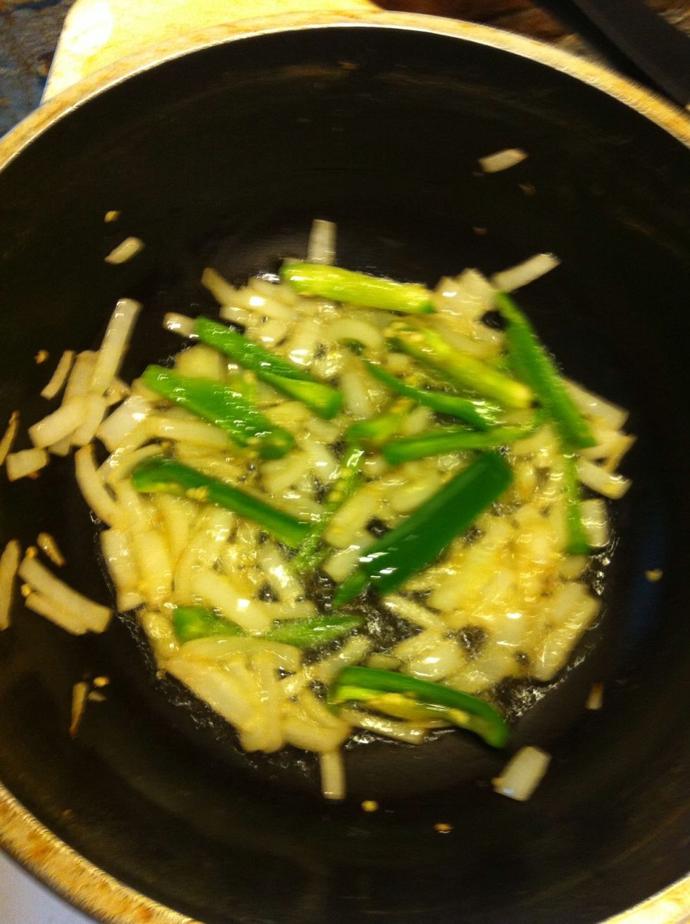 In a pan pour oil and wait for it to heat up. When it is hot put your onion and jalape\u00f1o in to get a golden brown color