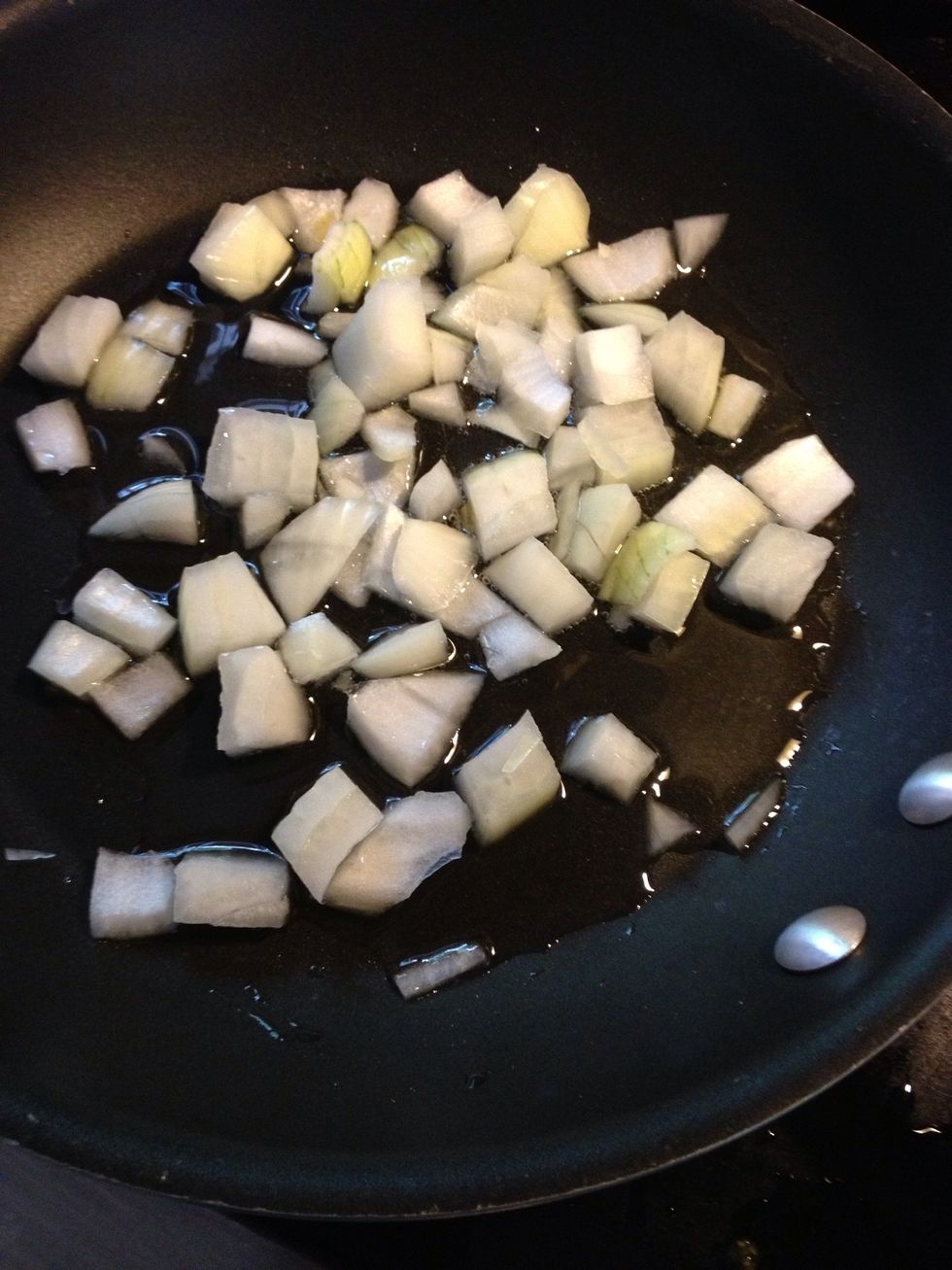 In a pan put 1/2 chopped onions