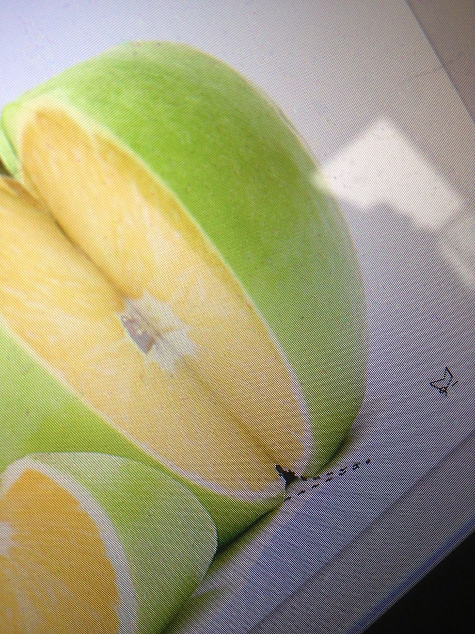 In a photo manipulation. It's the smallest details that make the image believable. So with your merge layer selected. Lower the opacity and start cutting out some areas where it overlaps the apple.