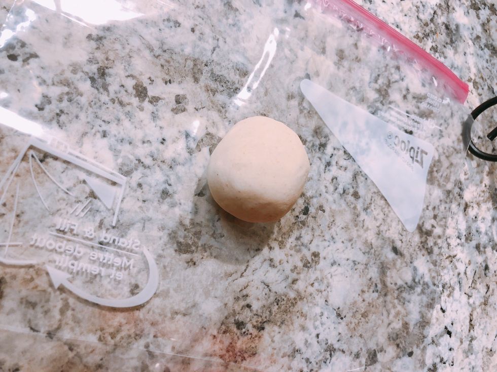 In a plastic ziplock bag (I cut the sides to have two open pieces)  Take a ball (size is your preference) this will depend how many you end up with