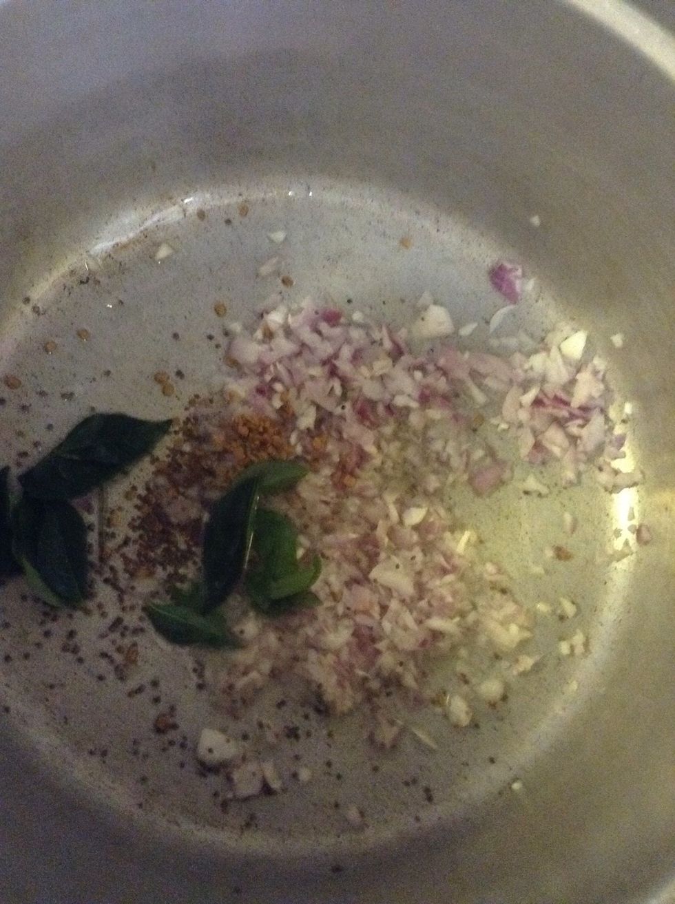 In a pot add corn oil, onion chopped, curry leaves and Fenugreek seeds, and mustard seed