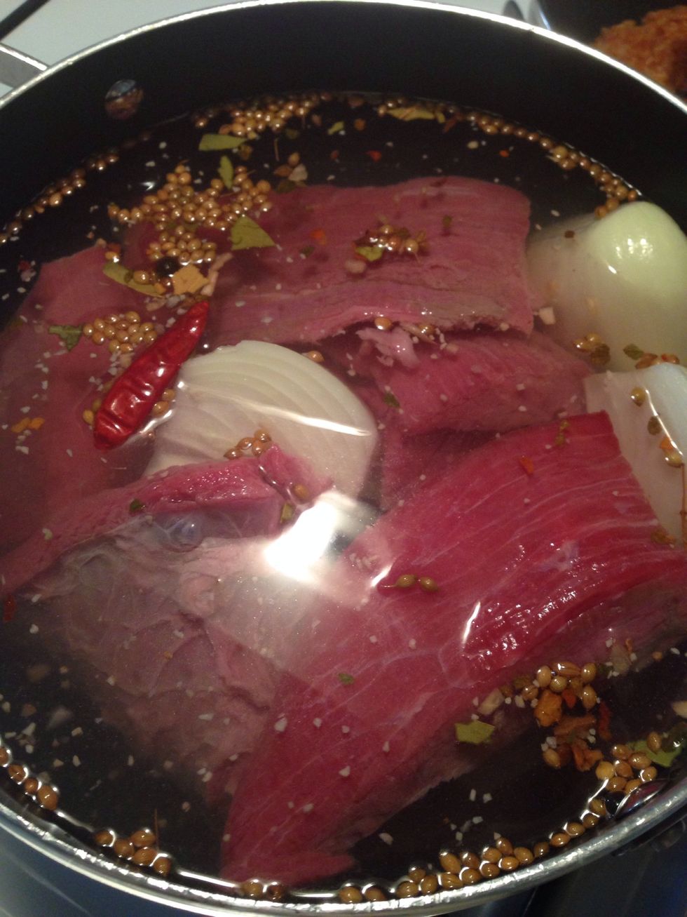 In a pot, boil beef shoulder with japonese chili, chipotle dry chili, Mexican spices, and onion. Boil it for 60-90 min until it become tender.