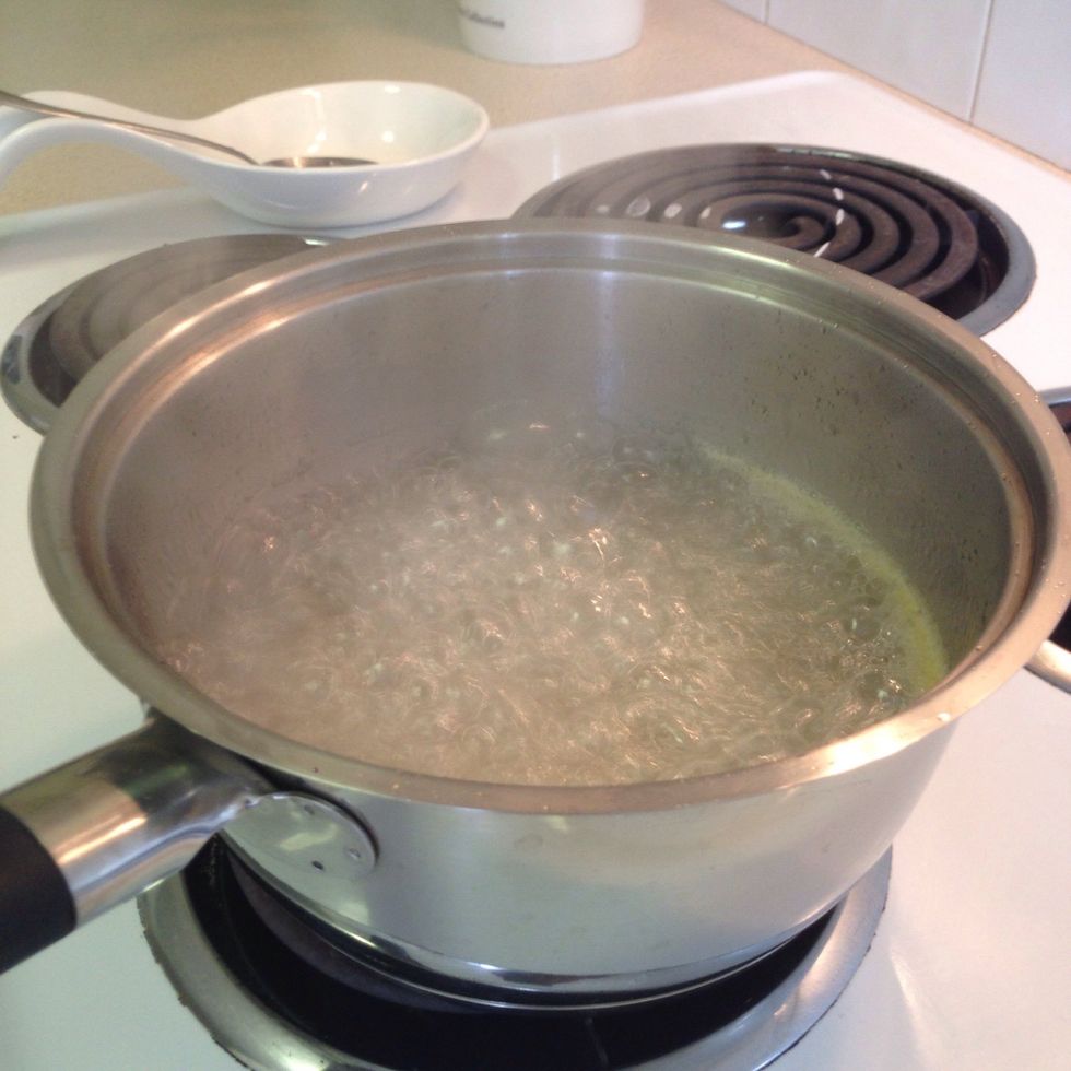 In a pot, combine the water and two cups of sugar and bring to a boil. Once you have reached a boil, add the 1 tbsp of lemon juice and allow to gently boil for 7 minutes before removing from heat.