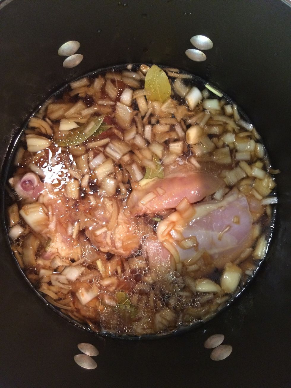 In a pot over medium heat, add the vegetable oil and the marinated mixture. Add one cup of water and cook for about an hour or so until the chicken is fully cooked.
