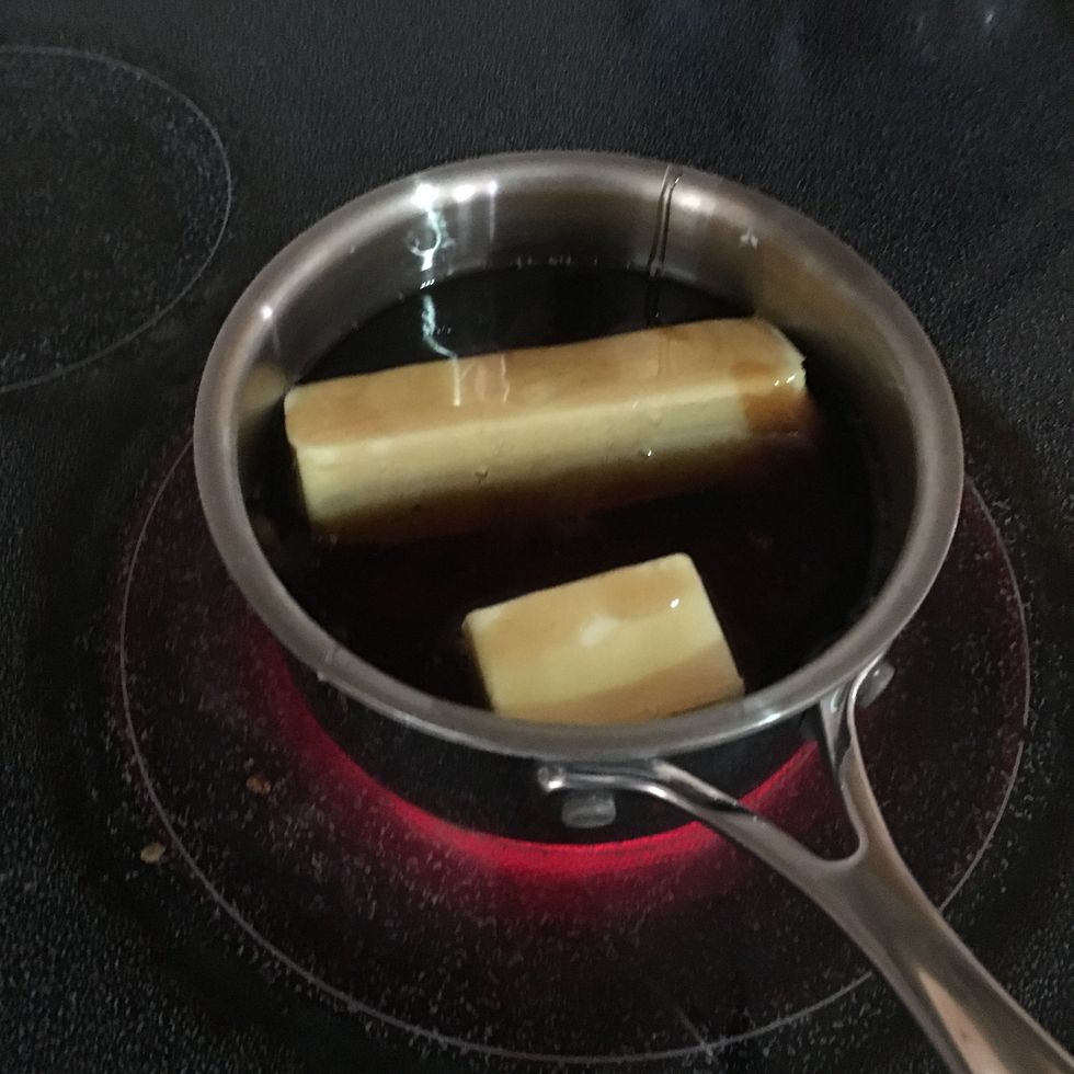 In a pot over medium heat, stir the honey, corn syrup and maple syrup until the butter is melted