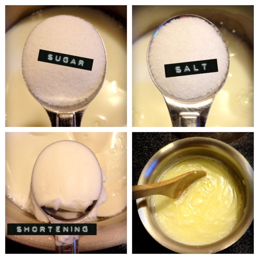 In a sauce pan over medium heat mix the milk, 2 tablespoons of sugar, salt, and shortening. Heat, stirring constantly, until the shortening melts. Be careful not to scorch the milk.