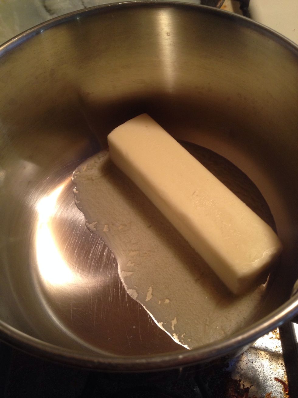 In a saucepan, melt 1 stick of butter.