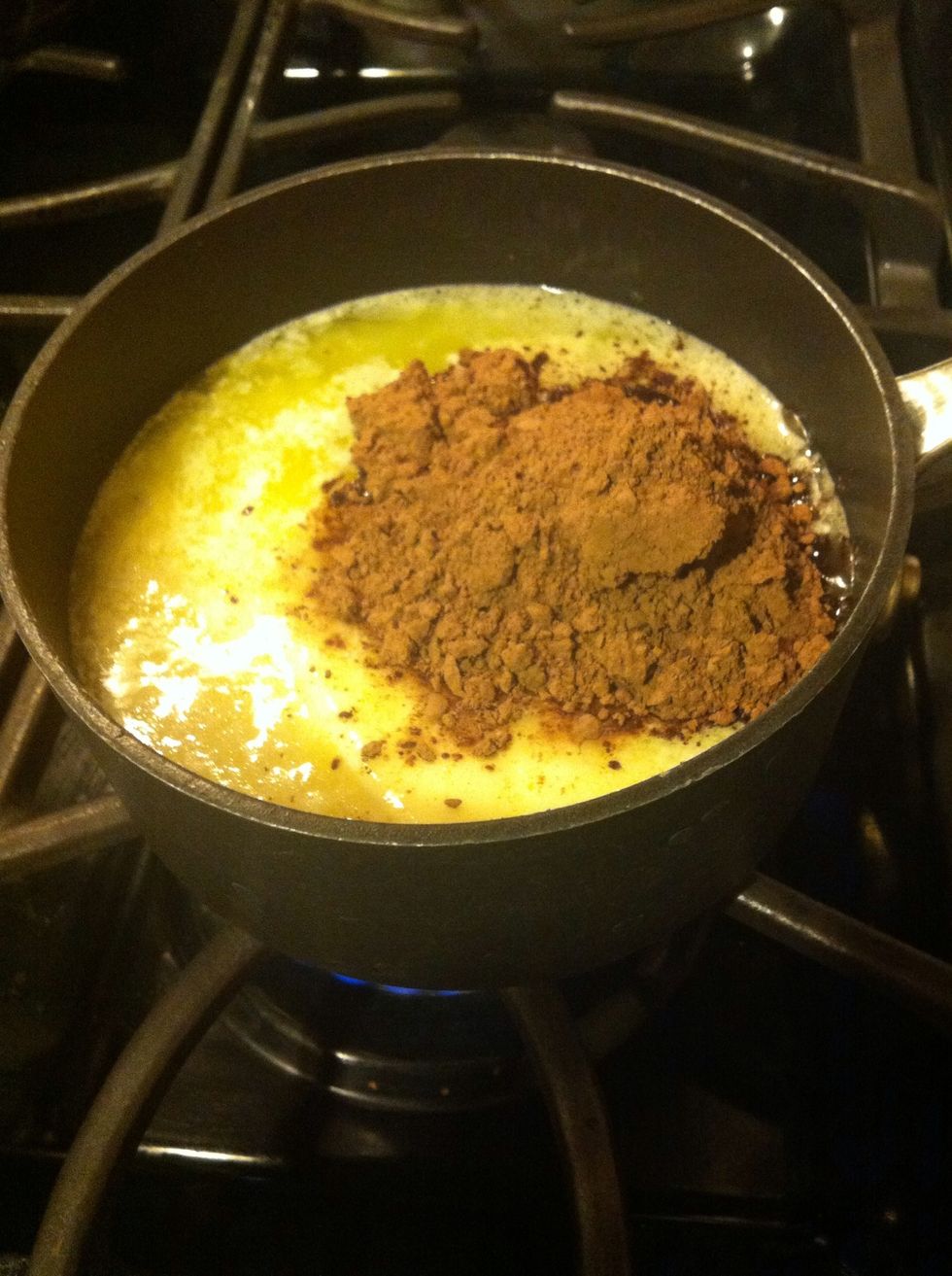 In a saucepan, melt together butter, 1 cup water, and 5 tbsp cocoa powder. Keep on low heat and let it boil.