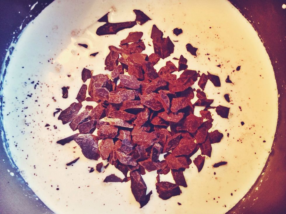 In a saucepan over medium/high heat, warm cream and milk. Whisk together. Pour in chocolate and stir chocolate until melted and smooth. Slowly add in vanilla and whisked eggs, whisk until smooth.
