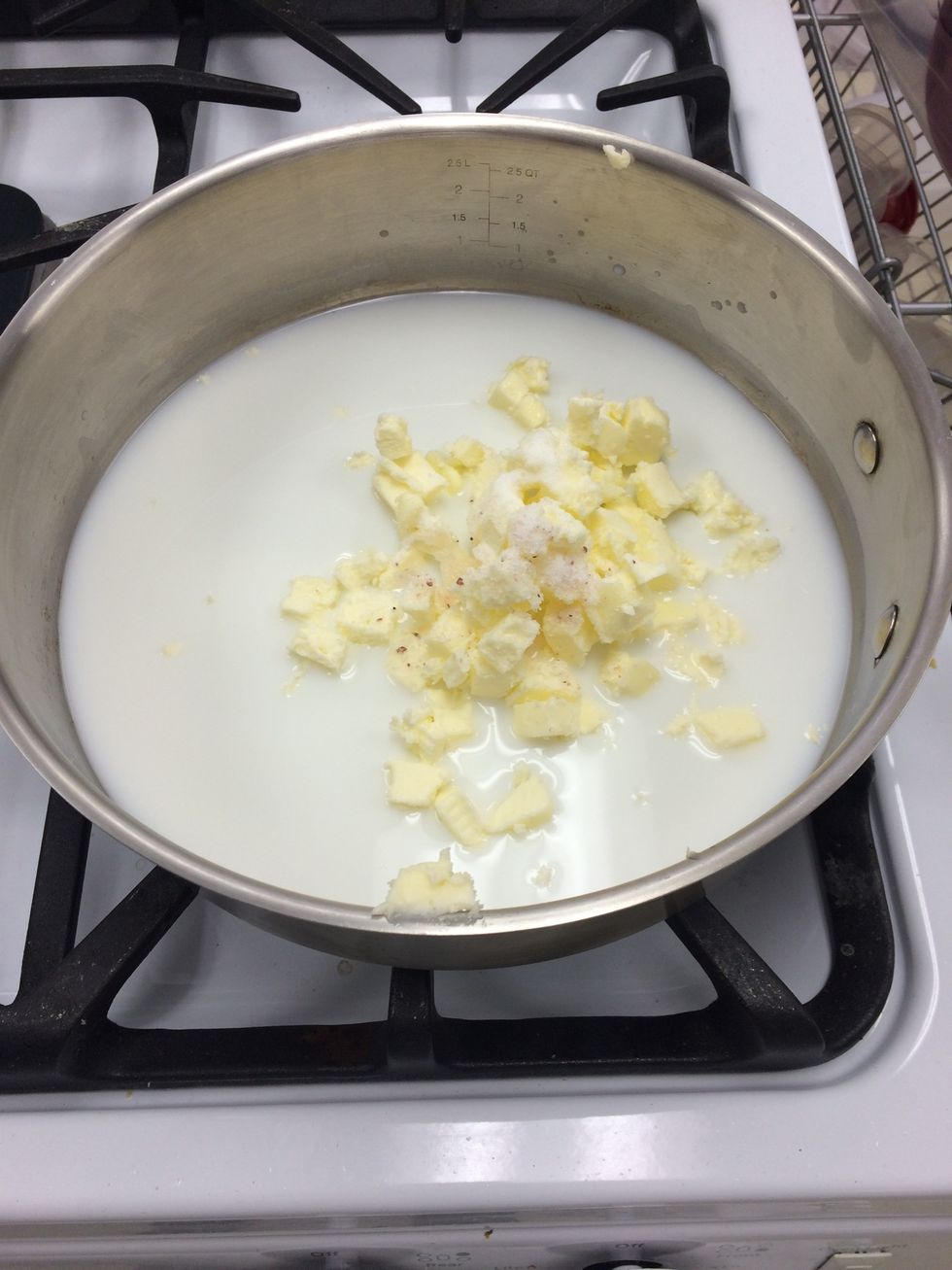 In a saucepan, whisk milk (125g whole milk) , water (125g) , butter (unsalted 110g), sugar (5g) and sea salt (5g) together until boiling