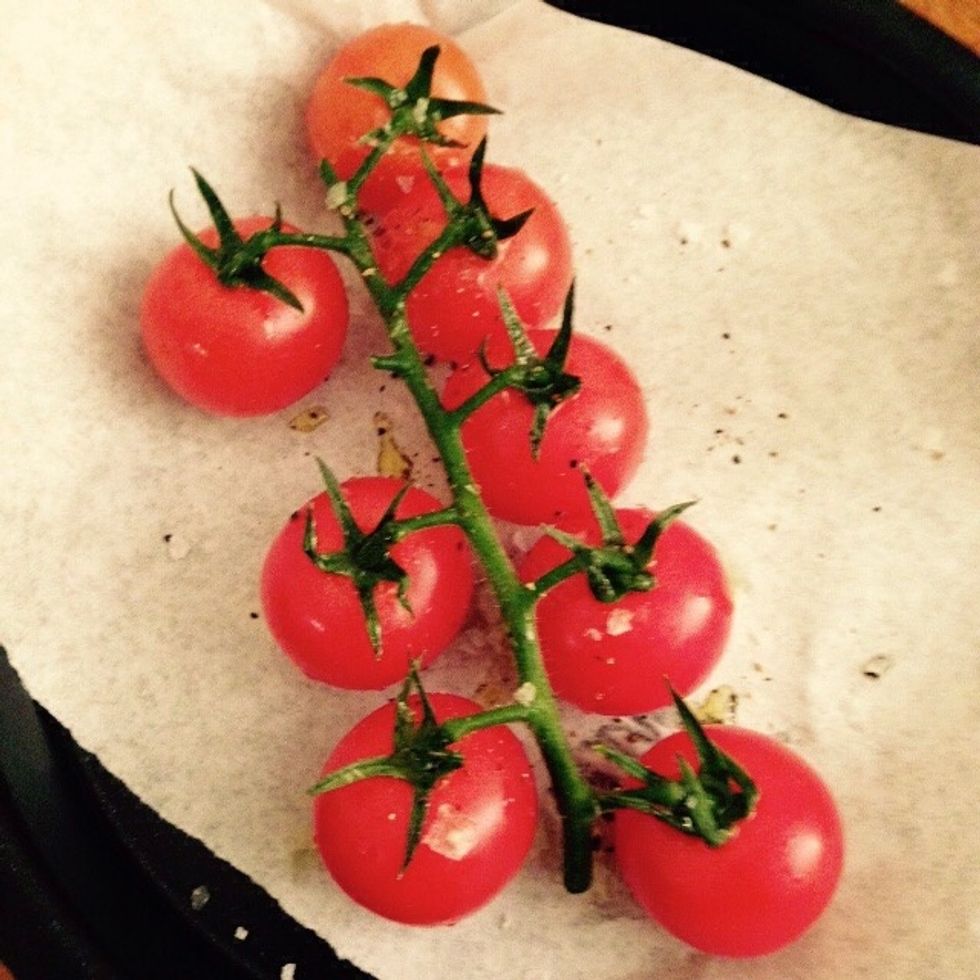In a separate baking tray add the vine grape tomatoes, drizzle with olive oil and season with black pepper and salt. Bake for 10min