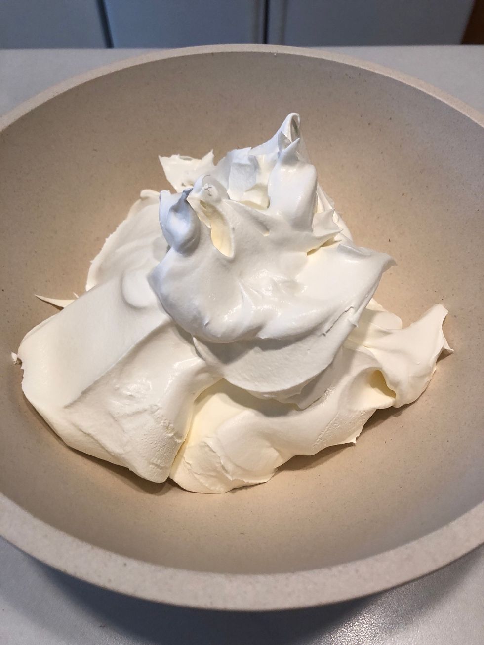 In a separate bowl, add both containers of whipped cream.