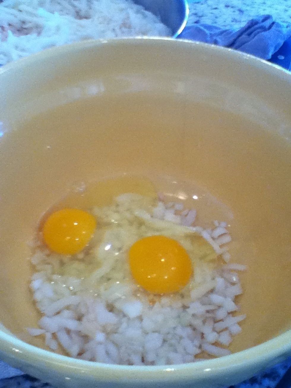 In a separate bowl add eggs and onions and mix.