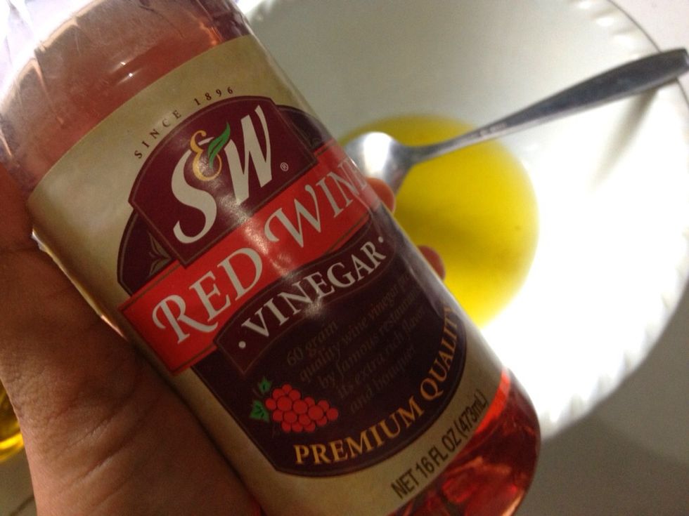 In a separate bowl, add in 6 tbsp of extra virgin olive oil and 2 tbsp of red wine vinegar