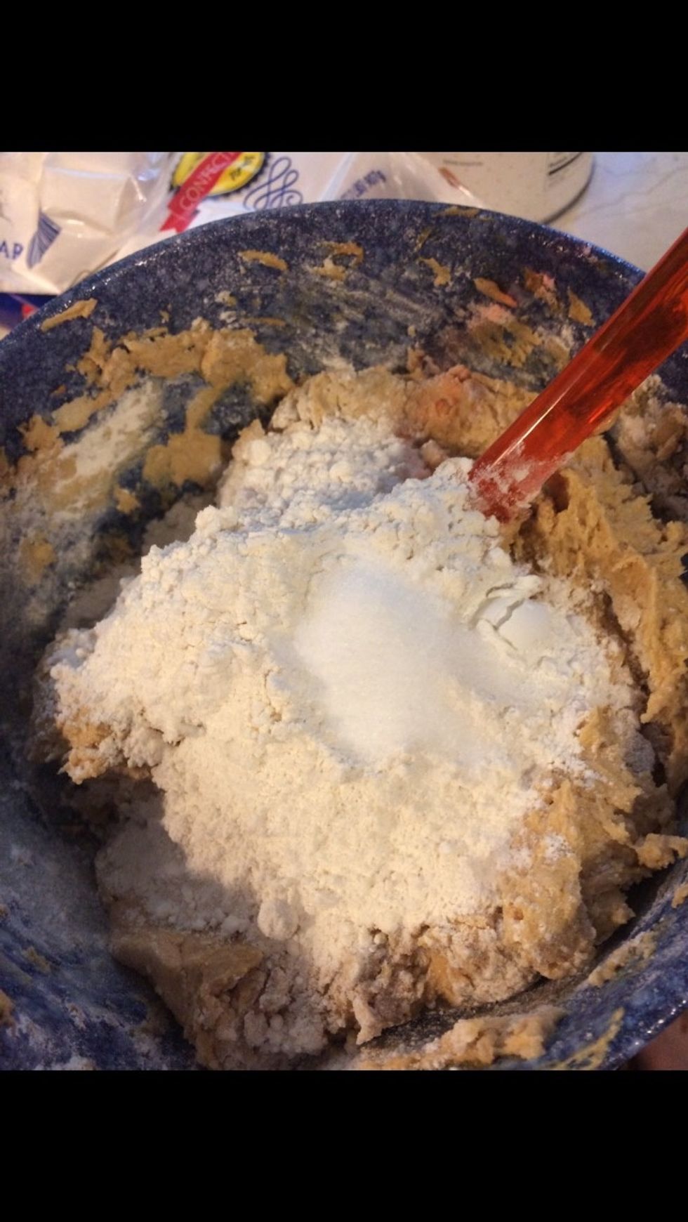 In a separate bowl, combine flour, baking soda, baking powder, and salt. Add small amounts to wet ingredients and mix until all ingredients are combined.