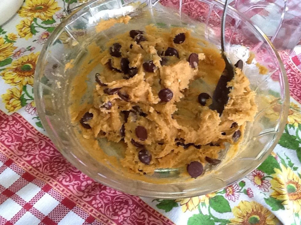 In a separate bowl, combine peanut butter, remaining 1 cup of sugar, and 1 egg. Stir the chocolate chips in.