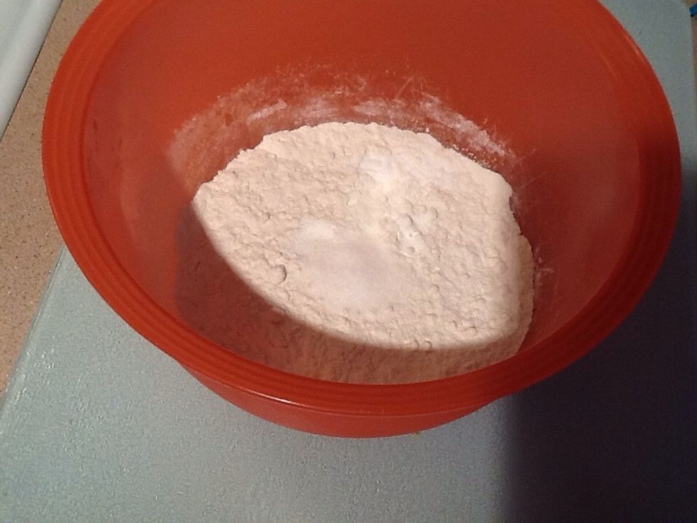 In a separate bowl combine with a wooden spoon, 1 1/2 cups of flour, 1/4 teaspoon baking soda, 1/4 teaspoon of baking powder and 1/2 teaspoon of salt