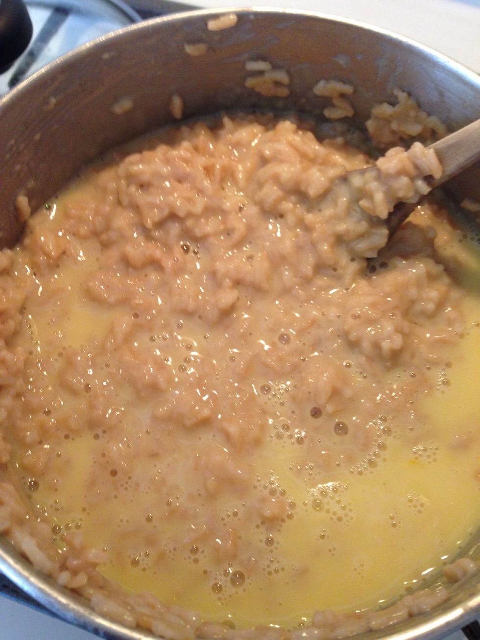 In a separate bowl gently beat the last cup of rice milk with two eggs. Add to rice mixture and simmer for 5 minutes while stirring to prevent the eggs from cooking to the bottom.