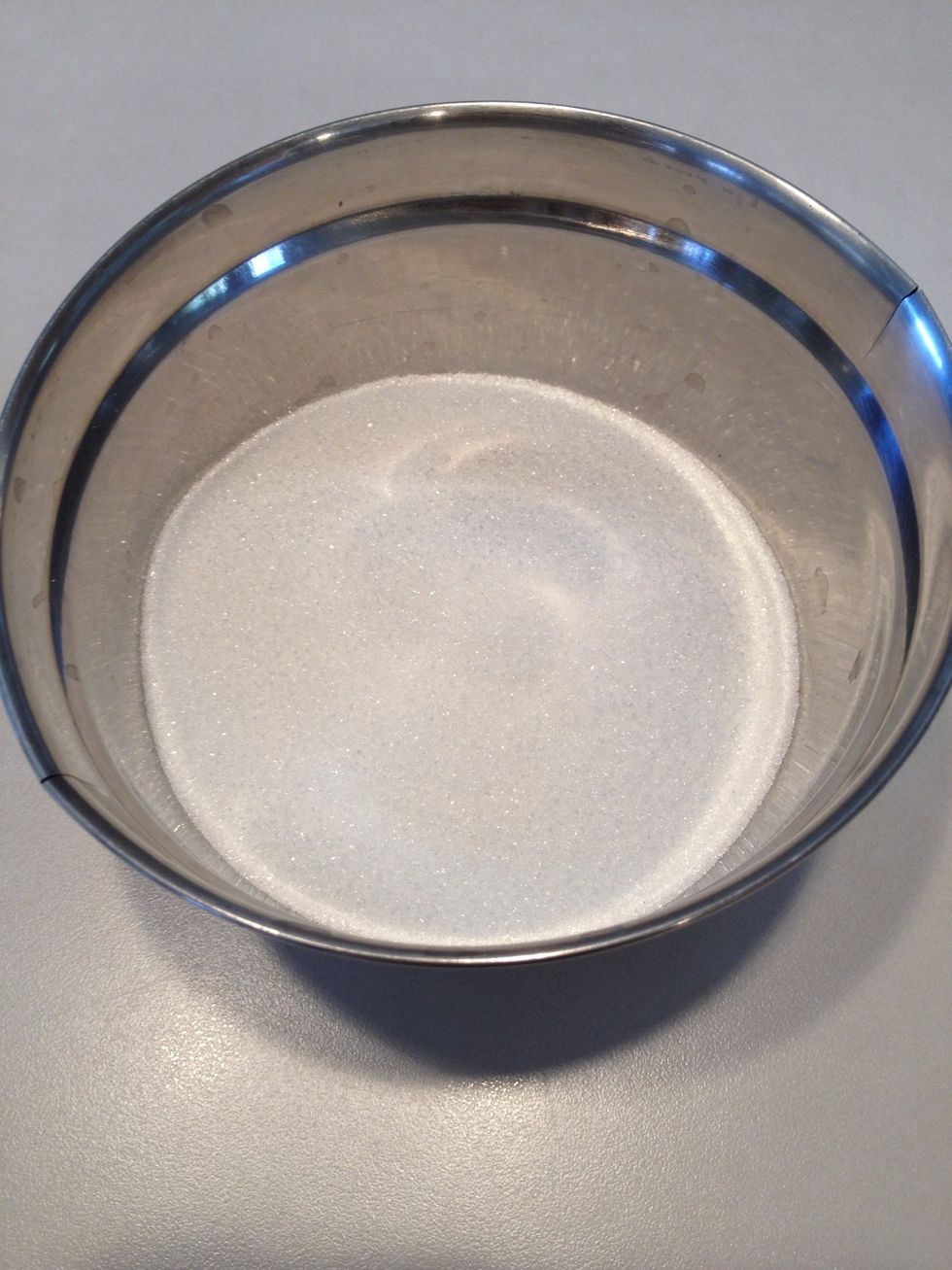 In a separate bowl, measure sugar.