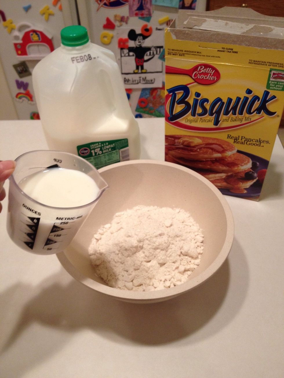 In a separate bowl, mix Bisquick with milk.